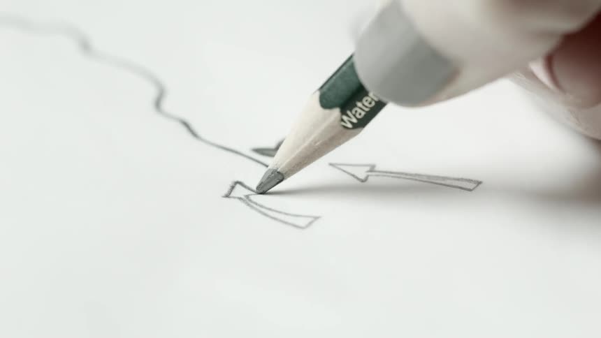 A person drawing with a pencil