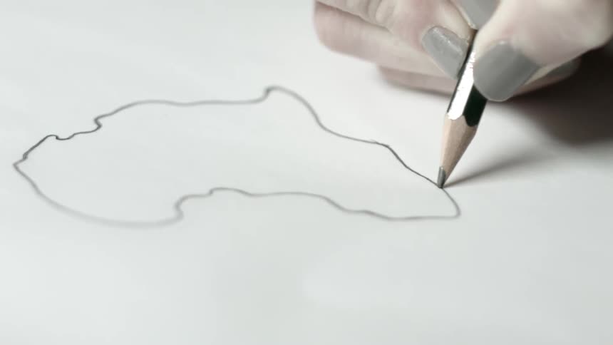 A woman is drawing africa