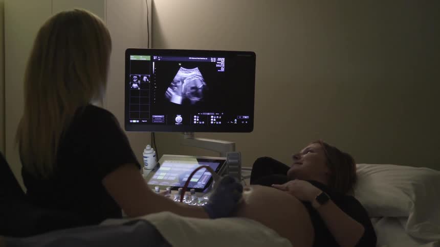A pregnant woman getting an ultrasound