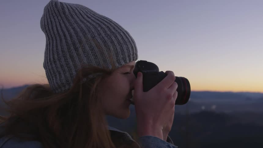 A woman taking a photo with a camera