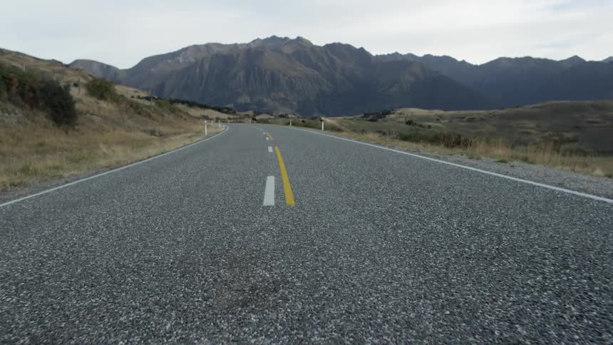 A rural road near mountains