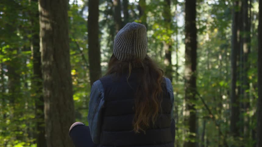Woman sitting in the woods
