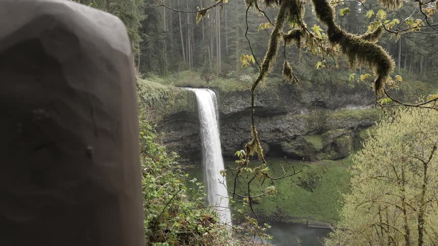 A waterfall falling over the edge of a cliff