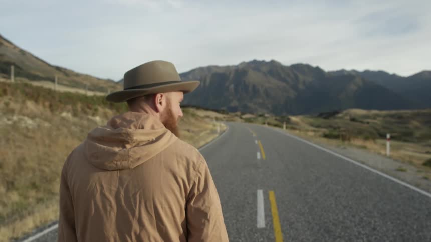 A man walking along the road