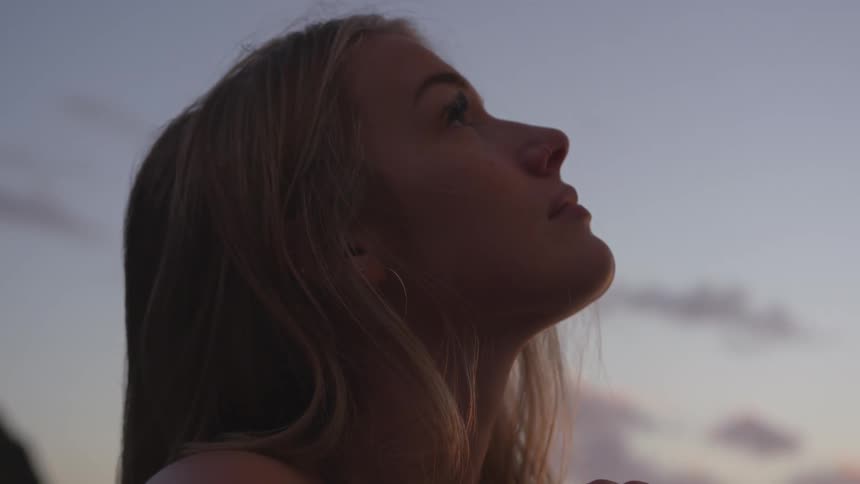 White woman looking at the sky