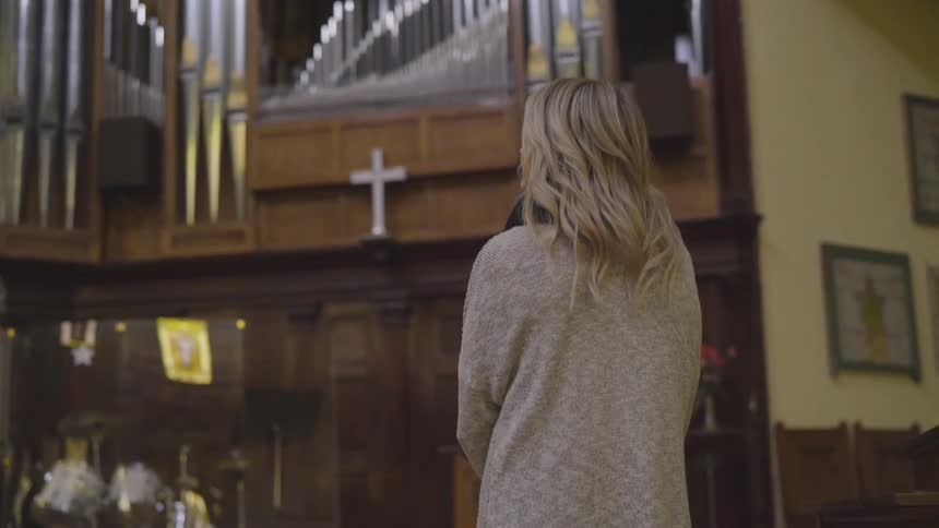 A woman standing in a church
