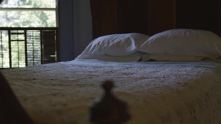 A bed that is in a bedroom
