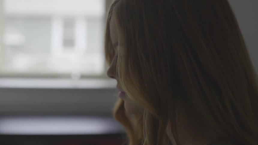 Profile of young woman with strawberry blonde hair