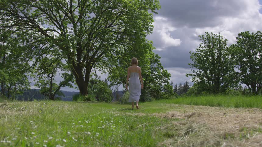 A woman walking away from the camera