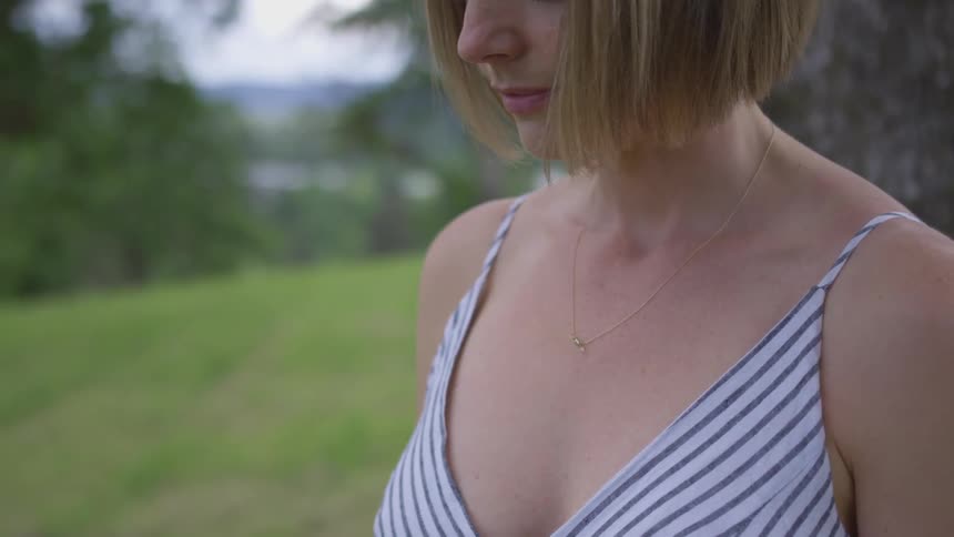Woman standing in a clearing in warm weather