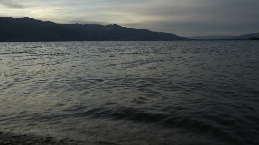 A quiet and calm beach on a cloudy evening,