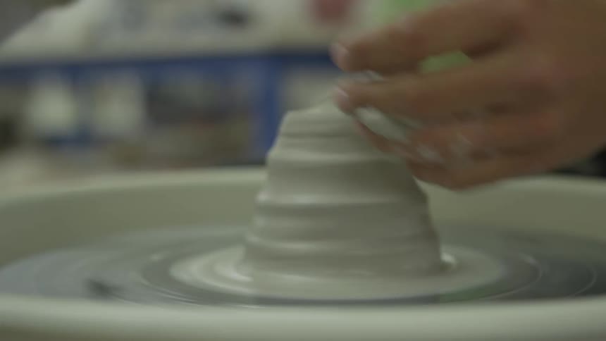 Girl molding clay