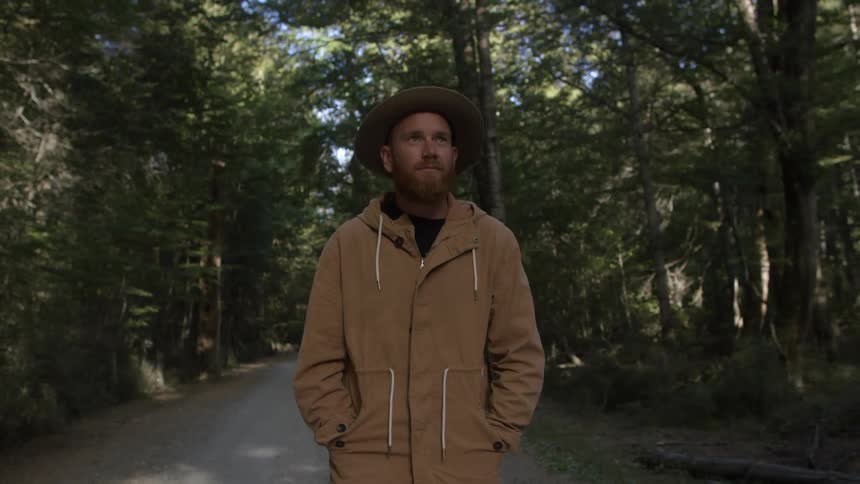 Man walks alone in the woods