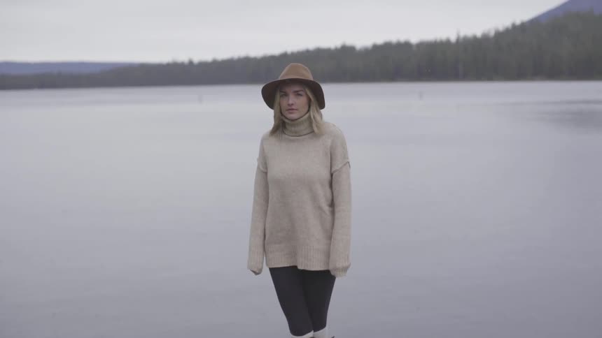 Woman standing next to a river