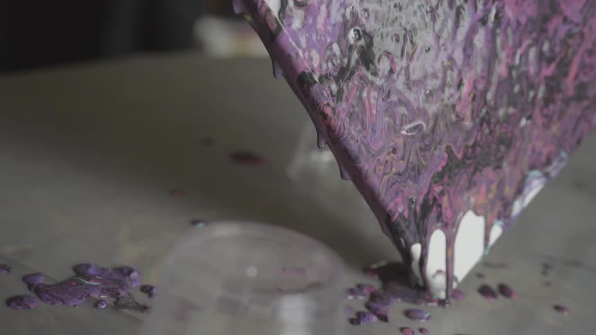 Water is dripping from a painting knife