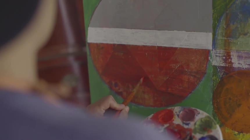Girl painting on a canvas