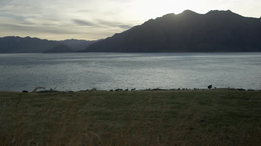 View of mountains, a lake and a shore