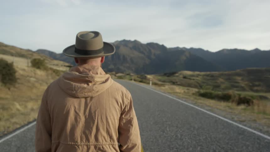 A man walking along the road