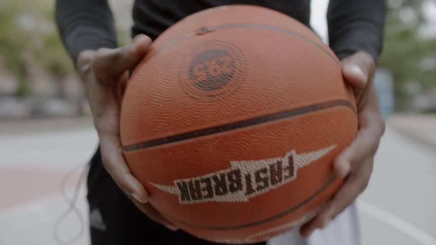 Young boy turns basketball multiple times
