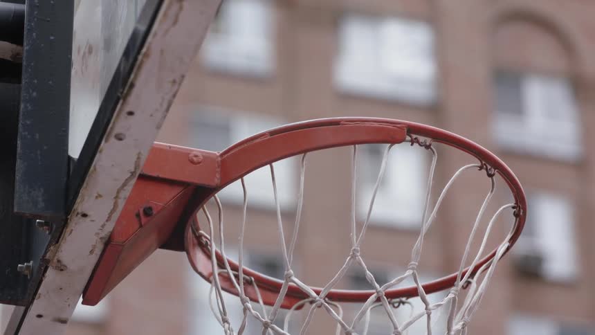 A basketball goes through the hoop