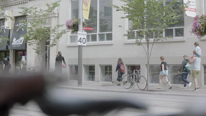 Many people walk on the busy sidewalk