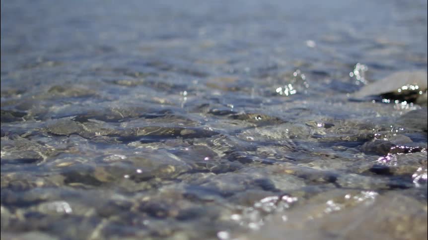 Shallow water ripples over stones
