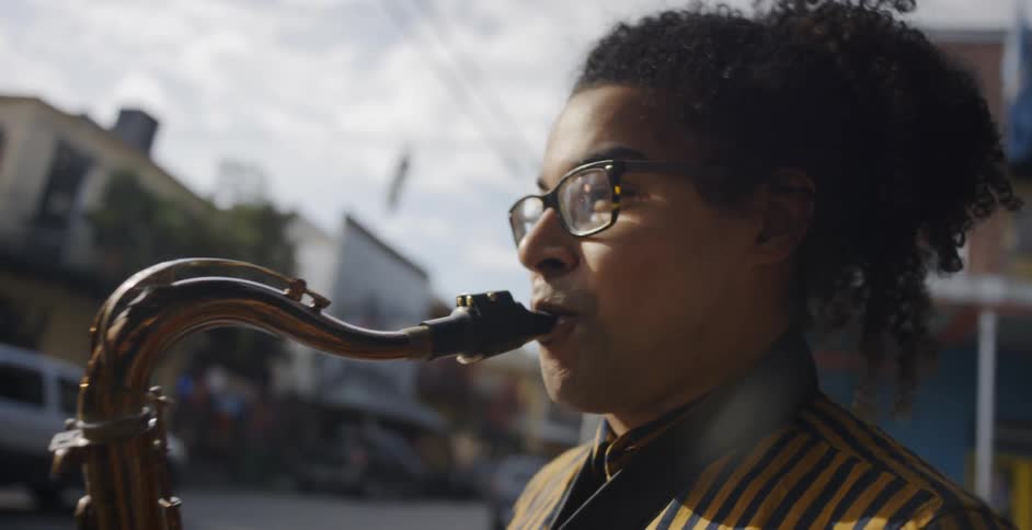 Man playing saxophone on street