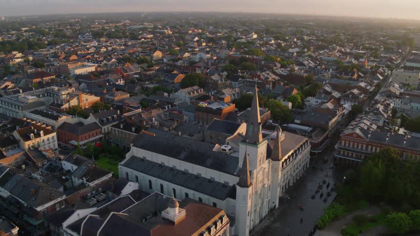 St louis cathedral in new orleans with city streets and building at sunset