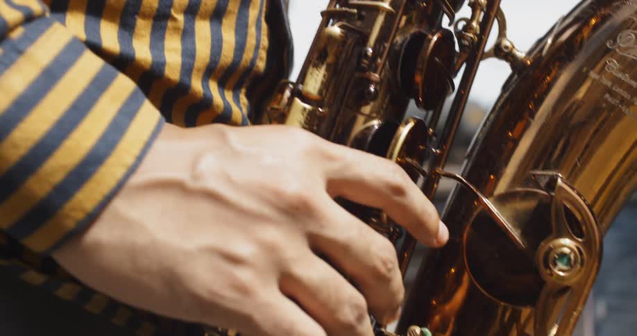 A person playing the saxophone