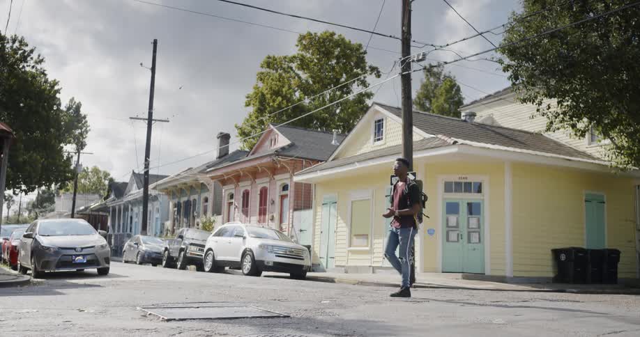 A man crossing the street at daytime