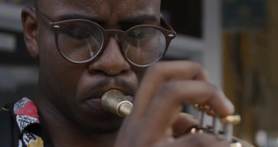 Black man playing trumpet