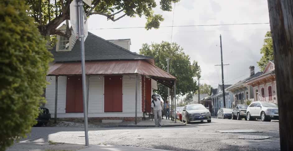 Person exits a house then runs across a street