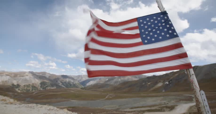 An american flag blowing in the wind