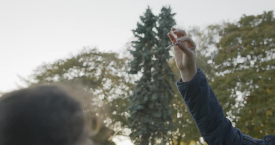 A young girl playing with toys in a park