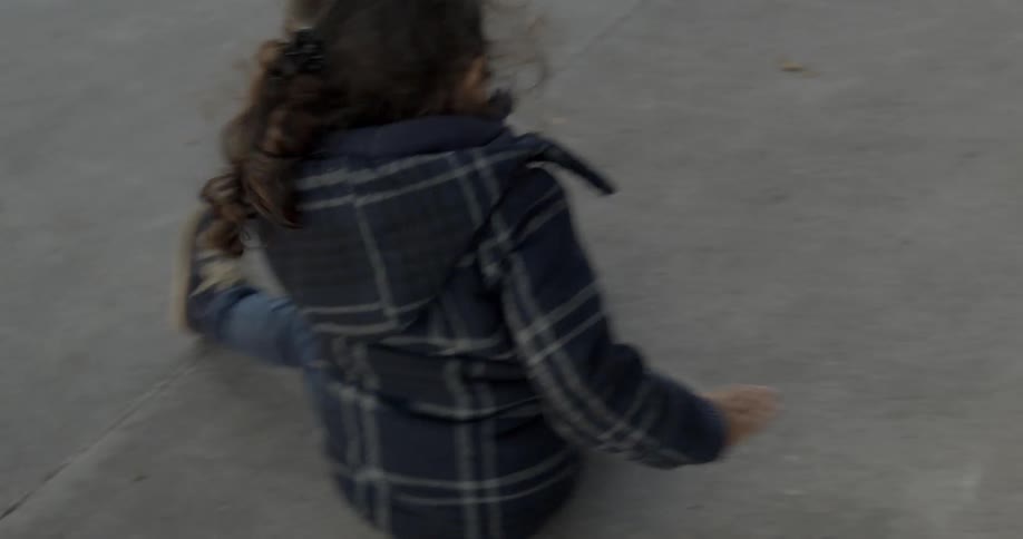 A child sliding down a slope