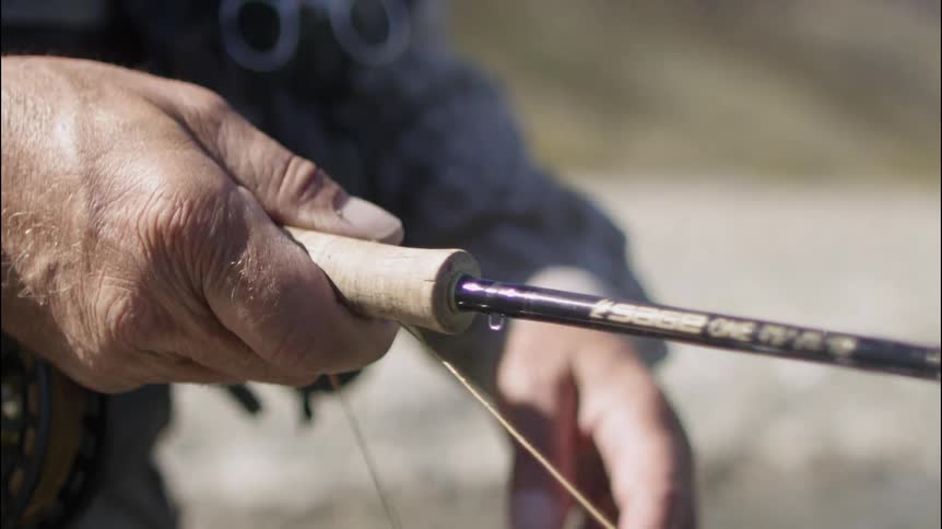 A person holding a fishing rod
