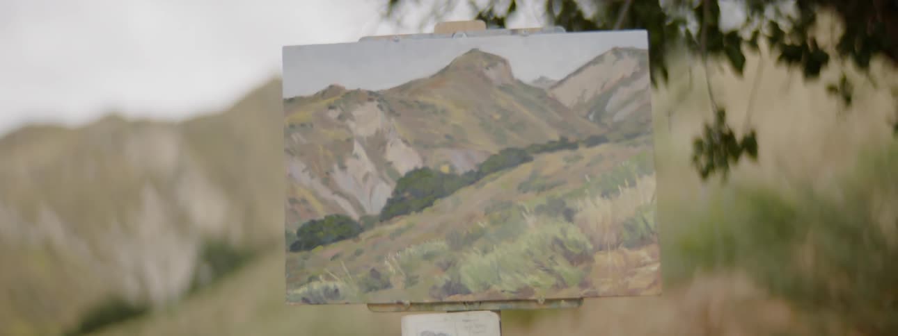 A painting next to a mountain