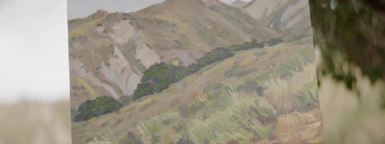 A painted canvas of mountains and valley in front of a mountain and valley