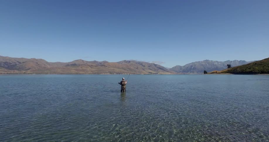 Man fishing in the middle of the water