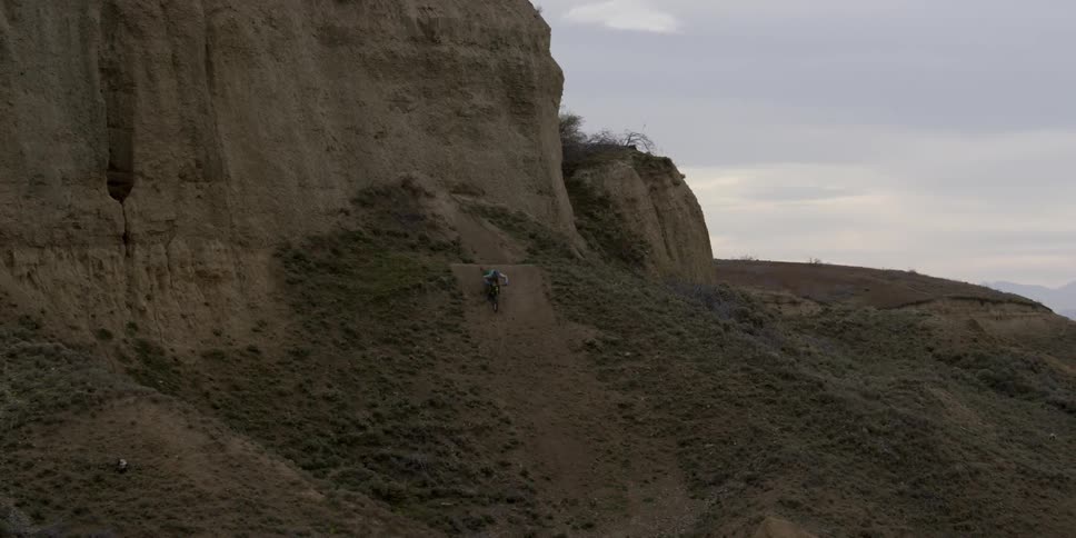 A person jumping off of a cliff