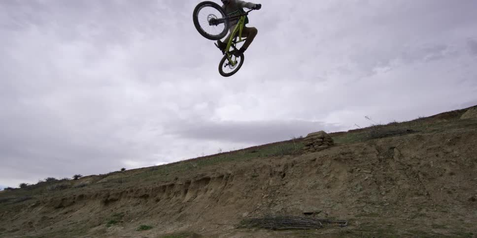 A person flying thru the air on a bike