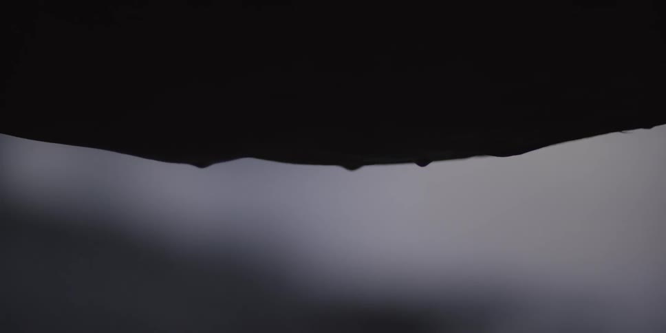 Water drips in a dim room