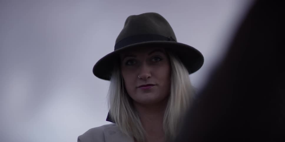 A woman wearing a hat