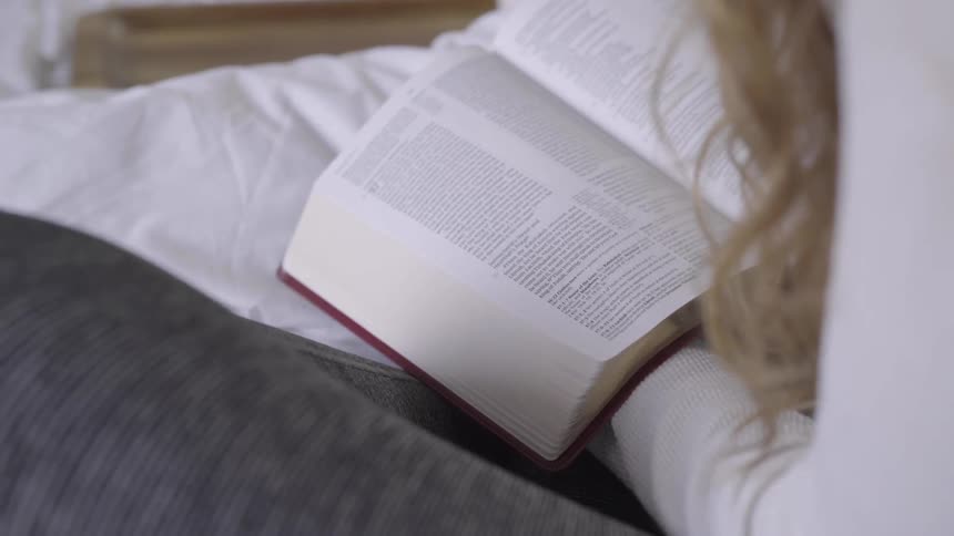A woman reads a book