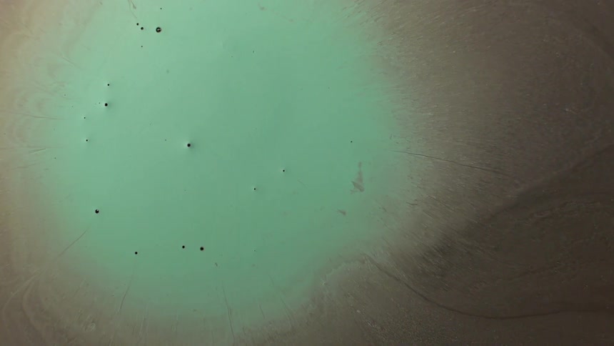 Green paint mixes with other colors