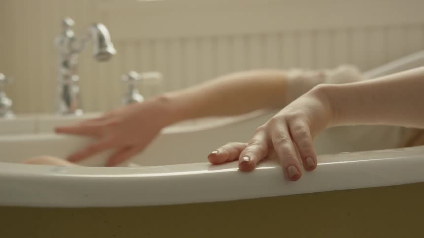 Woman soaks in bath tub