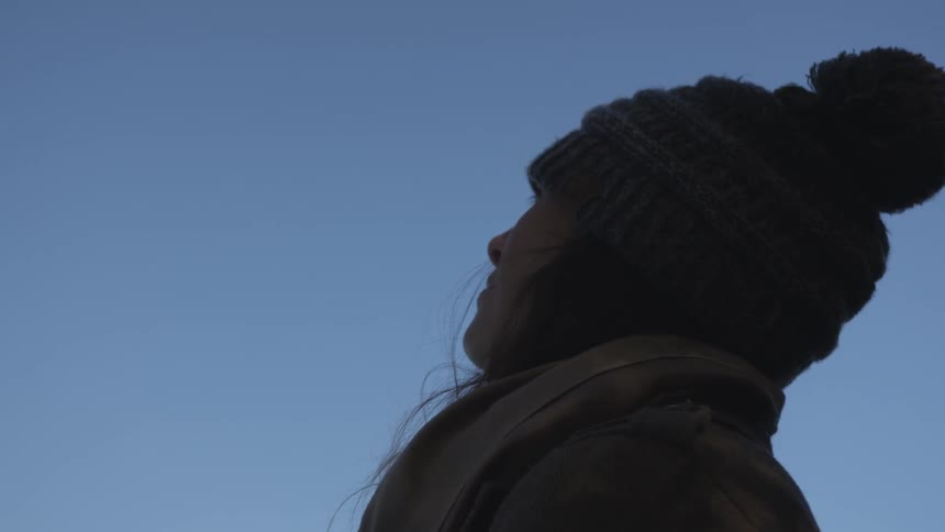 Girl looking up into the sky