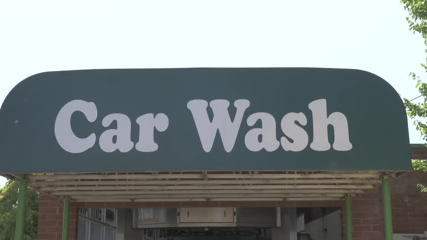 Close up of a car wash sign