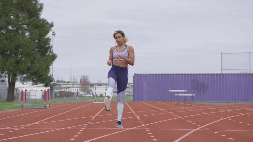 A woman preparing to run a race