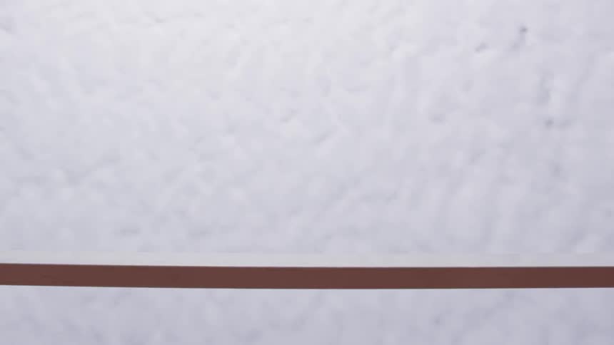The underside of a woman jumping over a hurdle